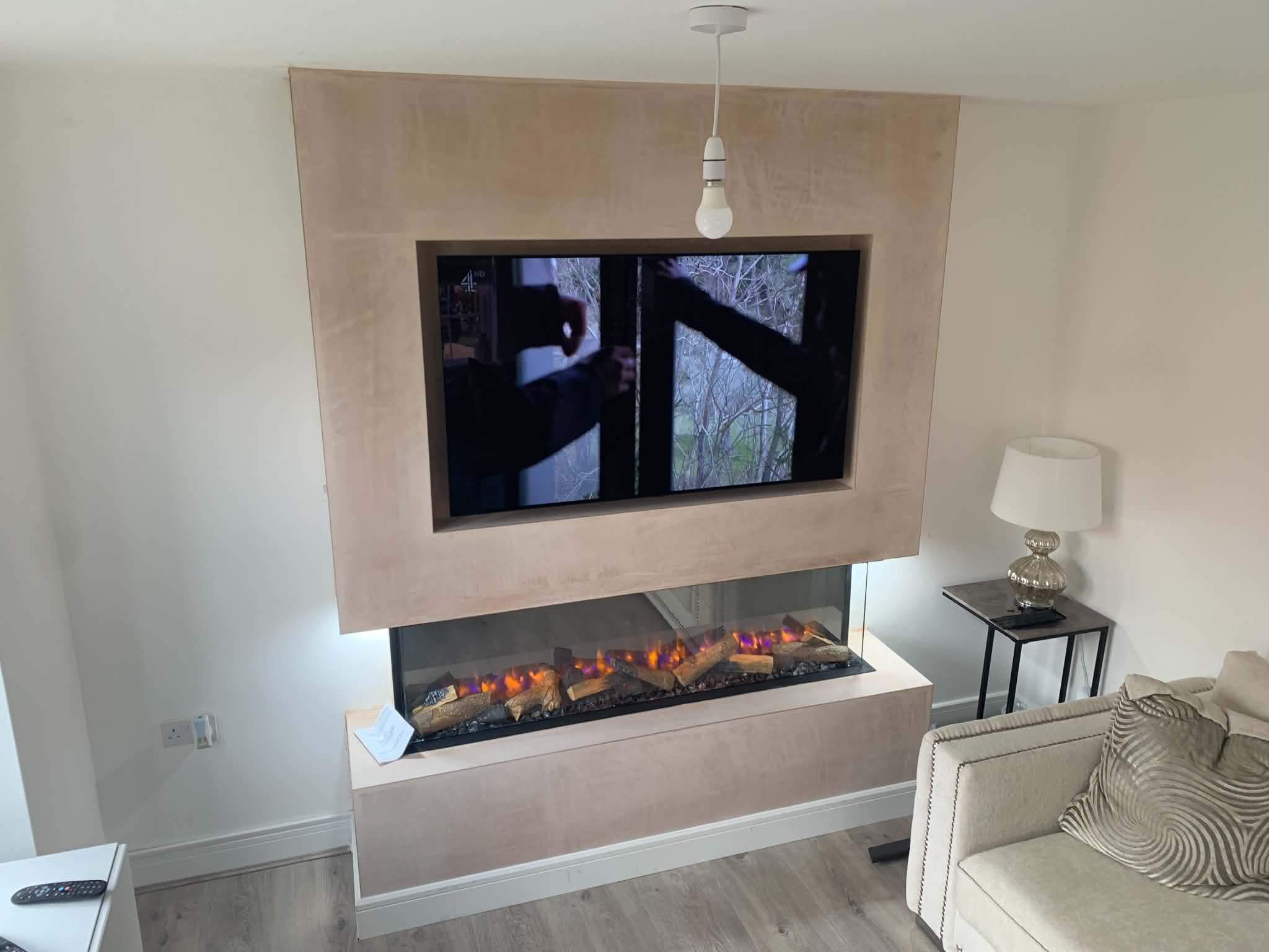 Modern media wall with marble-effect TV surround and grey slatted panels